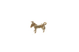 Small vintage African pendant of a standing impala ram with curved horns and aged patina.