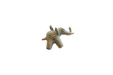 Vintage African bronze elephant pendant with a stylized coiled design and weathered patina.