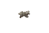 Vintage African bronze armadillo pendant with a textured, grid-like shell and aged patina.