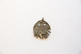 Reverse view of the vintage bronze jellyfish pendant showing its aged patina and texture.