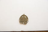 Rustic texture and aged patina on the vintage bronze jellyfish pendant.
