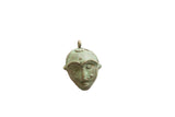 Vintage African bronze face pendant with an aged, greenish-brown patina and sculpted features.