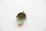 Back view of the vintage bronze pendant highlighting its concave interior and aged patina.