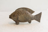 Vintage African fish sculpture with a dark patina and detailed, hand-carved scales.