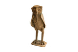 Vintage handmade African owl sculpture holding a snake in its beak.