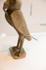 Side view of the vintage owl sculpture showing its textured, hand-carved wing and body.