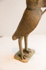 Side view of the vintage owl sculpture's body showing etched feather texture and aged patina.