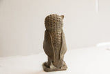 Back and side view of the vintage African owl sculpture, highlighting its textured carving.