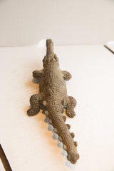 Vintage crocodile sculpture from an overhead angle highlighting its hand-carved texture.
