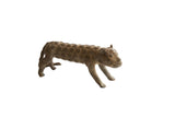 Vintage African cheetah sculpture featuring a textured body with raised spiral patterns.