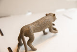 Rear view of the vintage African cheetah sculpture's textured, patterned back.