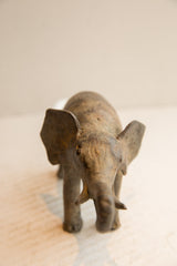High-angle frontal view of a handmade elephant showing its textured face and ears.