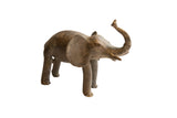 Vintage handmade African elephant sculpture with a rustic, earthy-brown texture and raised trunk.