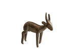 A vintage handmade African antelope sculpture with a dark bronze patina and textured surface.