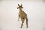 Rear view of the vintage African antelope sculpture showing hand-carved spine detail.