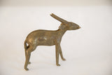 Side profile of the vintage African antelope sculpture showing its aged patina.