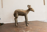 Vintage African ewe sculpture seen in profile, highlighting its aged, handmade patina.