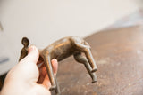 Aged patina and rustic texture on the hindquarters of the vintage African ewe sculpture.