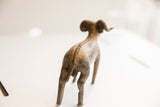 Rear view of the vintage ram sculpture with focus on the braided spine detail.