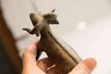 Handmade African ram sculpture showing the carved detail along its spine.