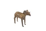 Vintage African ram sculpture with a dark, aged patina and rustic handmade details.
