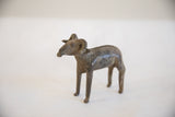 Angled view of the handmade African ram sculpture highlighting its rustic patina.