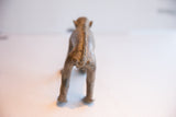 Detailed, stitched-like spine on the back of the handmade African monkey figurine.