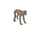 Vintage African monkey figurine with a weathered patina and handmade texture.