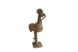 Vintage African rooster with snake sculpture in textured metal with a weathered, aged patina.