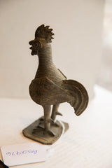 Handmade texture and sturdy base of the vintage African rooster sculpture.