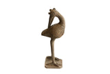 Vintage handmade African bird sculpture with a backwards-facing head and a textured patina.