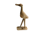 Vintage African bird sculpture holding a fish, with a textured handmade surface and aged patina.