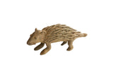 Vintage African porcupine sculpture with a rough, handmade texture in an earthy brown tone.