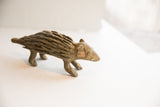 Earthy brown vintage porcupine sculpture showing the layered texture of its handmade quills.