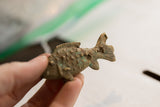 Handmade texture and aged green patina on a vintage African fish figurine.