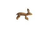 Vintage African rabbit figurine with a weathered, handmade texture in a running pose.