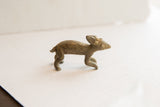 Vintage African rabbit figurine in profile showing its simple, handcrafted form.