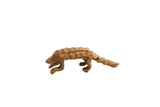 Vintage African pangolin figurine with a rustic brown finish and handmade, textured details.