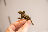 Vintage African porcupine figurine held in hand to show its small scale and texture.