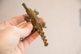 Vintage African crocodile sculpture showing its unique textured casting and imperfections.