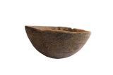 Antique African hand-carved wooden bowl with incised designs and zig-zag repairs.