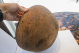 Nupe hand carved wooden bowl with incised patterns, aged texture, and old repair.