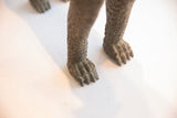 Textured legs and clawed feet of the vintage African leopard casting.
