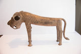Side profile of the vintage African lion dog sculpture highlighting its carved mane and open jaw.