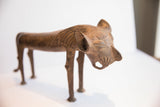 Angled view of the vintage lion dog sculpture's head, showing its carved mane and textured surface.