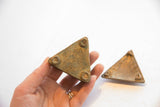 Underside view of the African triangle box, revealing aged patina and raised feet.