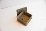 Open vintage African square box revealing the aged patina of its handmade interior.