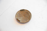 Interior view of the vintage African box lid showing an aged patina and small handmade tabs.