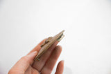 Side profile of the African box lid, showing its thickness and handmade edge detail.