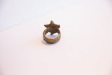 Rear view of the cast bronze turtle ring highlighting the band's rustic texture.